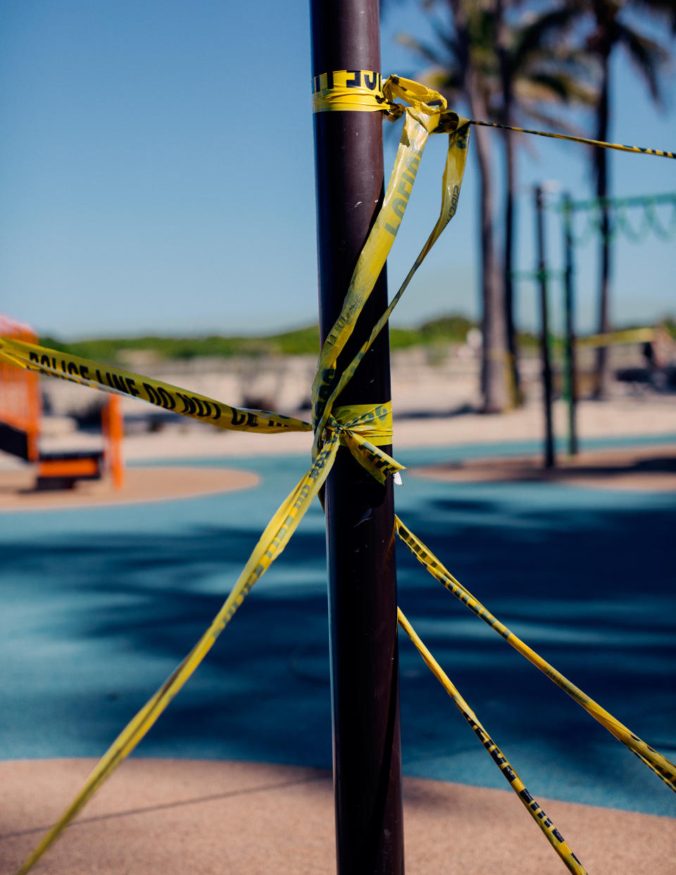 A playground in front of the temporarily closed Betsy Hotel is covered in caution tape as parks remain closed in Miami Beach. | Rose Marie Cromwell for TIME