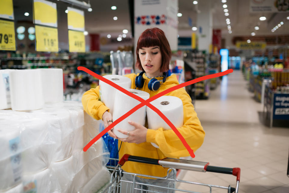 an "x" on a photo with a woman holding paper towels