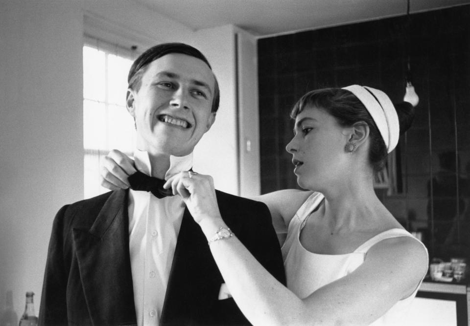 Designer and restaurateur Terence Conran of St John's Wood, London, prepares for a night out in London with his wife, journalist and author Shirley Conran, June 1955. Original Publication : Picture Post - 8083 - Twenty Shillings Or Twenty Pounds - unpub. (Photo by Thurston Hopkins/Picture Post/Hulton Archive/Getty Images)