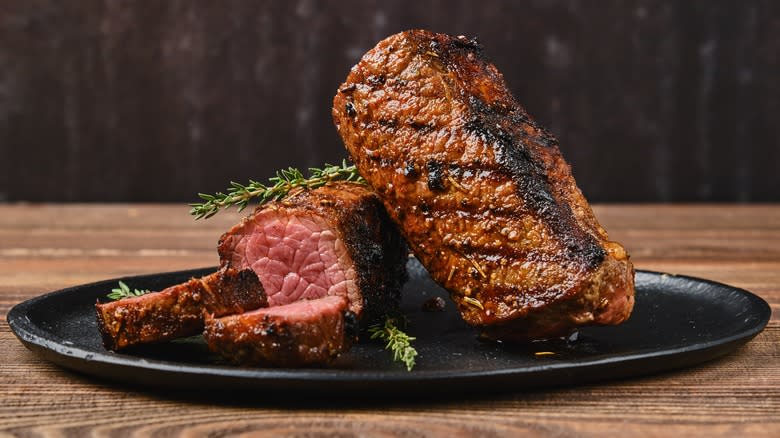 Two pieces of steak on plate