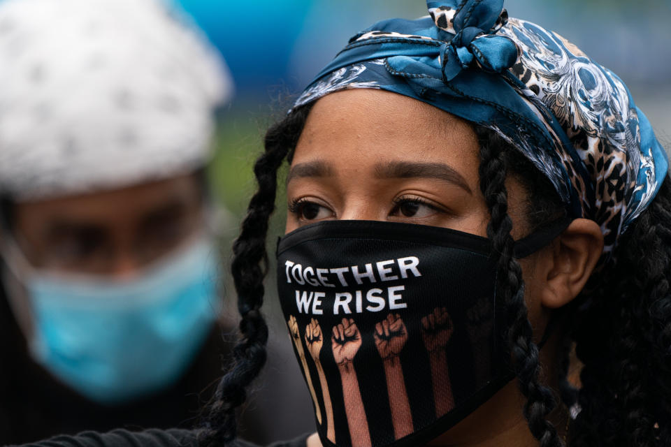 A demonstrator at a Black Lives Matter protest on Wednesday in the Harlem neighborhood of New York City. (Photo: Jeenah Moon via Getty Images)