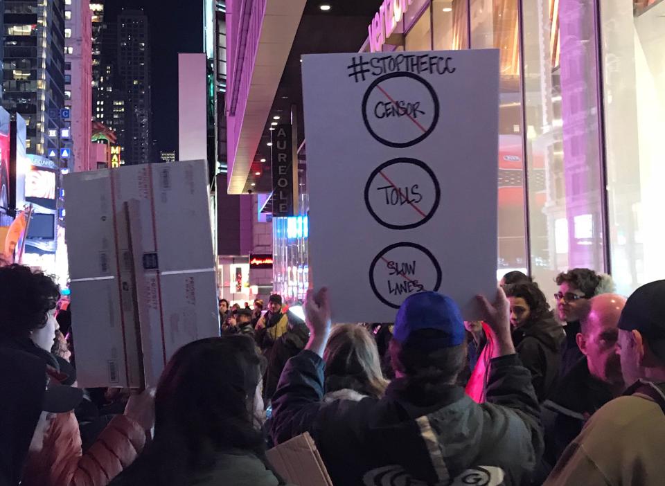 Net neutrality supporters gather at a rally in front of a Verizon store on 42nd Street in New York City on Dec. 7. (Photo: Jenna Amatulli)