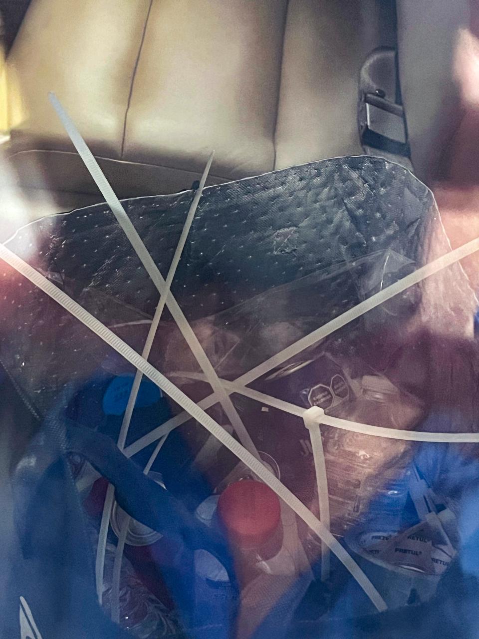 Close-up of plastic zip ties inside the plane that carried alleged drug kingpin Ismael "El Mayo" Zambada to the United States on Thursday, July 25, 2024.