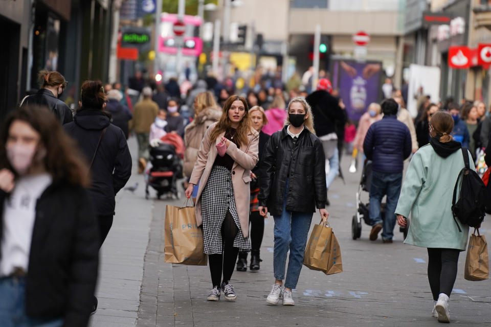 Shoppers wearing face masks walk through the streets of Nottingham on 28 October 2020. (Photo by Giannis Alexopoulos/NurPhoto via Getty Images)