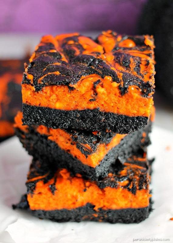 <p>Persnickety Plates</p><p><strong>Adding a small drop of orange food color gives cream cheese swirl brownies a great festive look. </strong></p><p><strong>Get the recipe: <a href="https://www.persnicketyplates.com/halloween-cream-cheese-swirl-brownies/" rel="nofollow noopener" target="_blank" data-ylk="slk:Halloween Cream Cheese Swirl Brownies;elm:context_link;itc:0;sec:content-canvas" class="link ">Halloween Cream Cheese Swirl Brownies</a></strong></p>