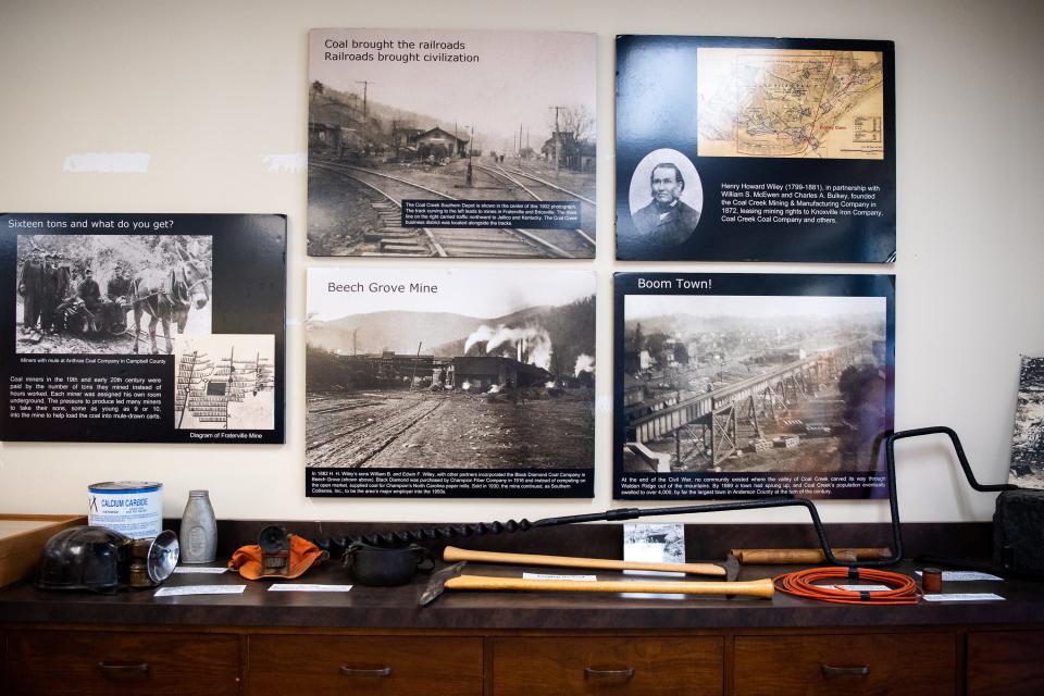 Photos of the area's mining history are displayed inside the Coal Creek Miners Museum, along with old mining equipment.