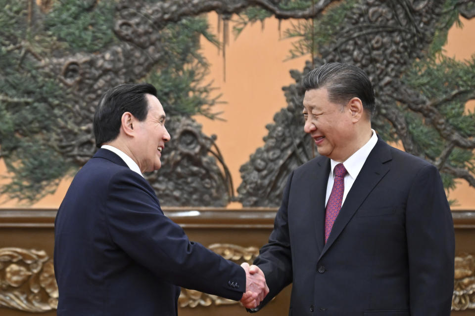 In this photo released by Xinhua News Agency, Chinese President Xi Jinping, right, shakes hands with former Taiwanese President Ma Ying-jeou as they meet in Beijing on Wednesday, April 10, 2024 in a bid to promote unification between the sides that separated amid civil war in 1949.(Ju Peng/Xinhua via AP)