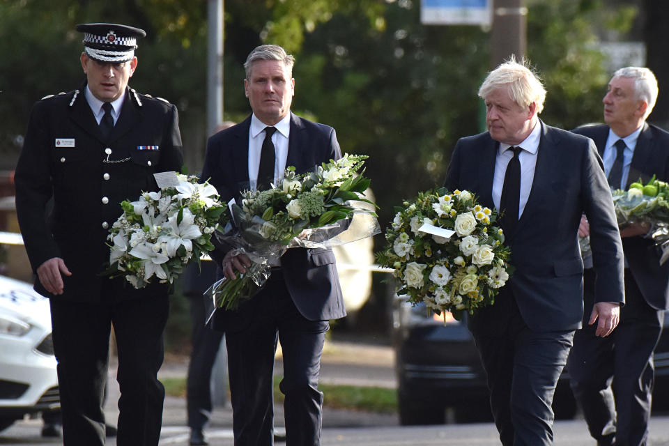 Labour Party Leader Keir Starmer and Prime Minister Boris Johnson arrive to lay flowers outside the Belfair Methodist Church following the stabbing of UK Conservative MP Sir David Amess as he met with constituents, on October 16, 2021 in Leigh-on-Sea, England.  / Credit:  Getty Images