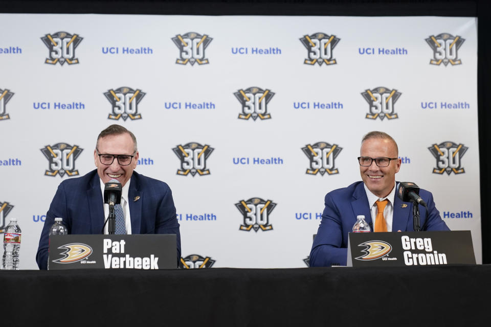 Anaheim Ducks General Manager Pat Verbeek, left, announces the team's new head coach, Greg Cronin, during a press conference in Anaheim, Calif., Monday, June 5, 2023. (AP Photo/Ashley Landis)