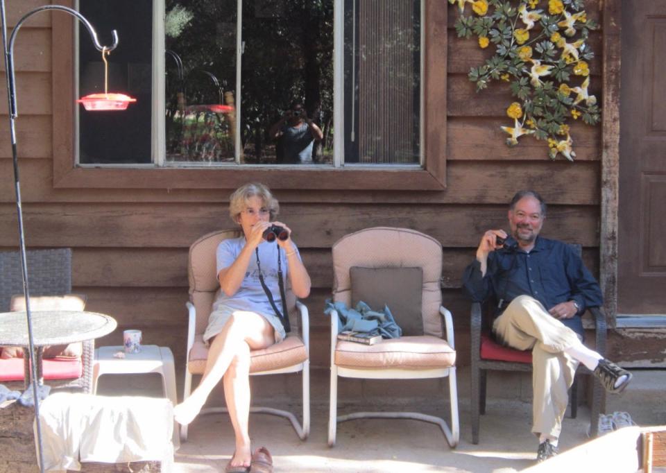 Jane and David Moss birdwatching near the Chiricahua Mountains in Arizona.