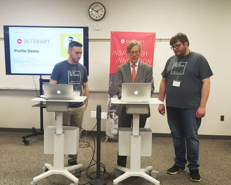 Earl Gohl (C), co-director of the Appalachian Regional Commission, is participating in a coding demo with Interapt trainees in Paintsville, Kentucky, U.S. on March 13, 2017. REUTERS/Valerie Volcovici