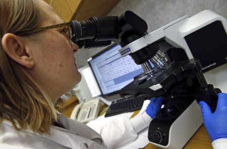 Shay Wilinski works in the Microbiology Lab at Community Hospital, where a patient with the first confirmed U.S. case of Middle East Respiratory Syndrome is in isolation, in Munster, Indiana, May 5, 2014. REUTERS/Jim Young