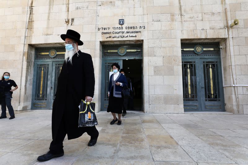 Ultra-Orthodox Jewish people, family members of Malka Leifer, a former Australian school principal accused of sexually assaulting students, walk out of the District Court after a verdict was heard in the extradition case against Leifer, in Jerusalem