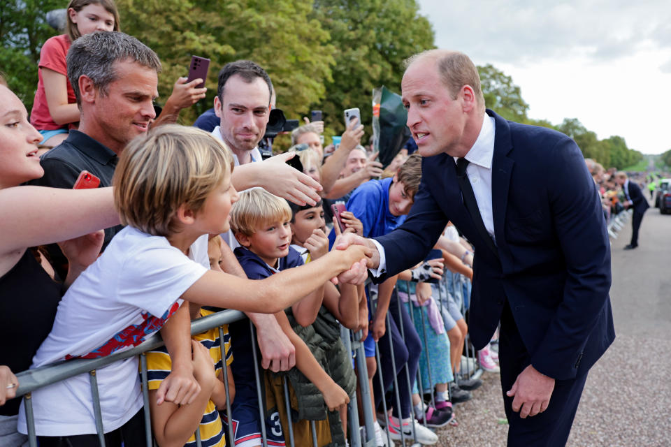 <p>Prince William, Prince of Wales shakes hands with members of the public on his walkabout at Windsor Castle on Sept. 10, 2022 in England. (Photo by Chris Jackson - WPA Pool/Getty Images)</p> 