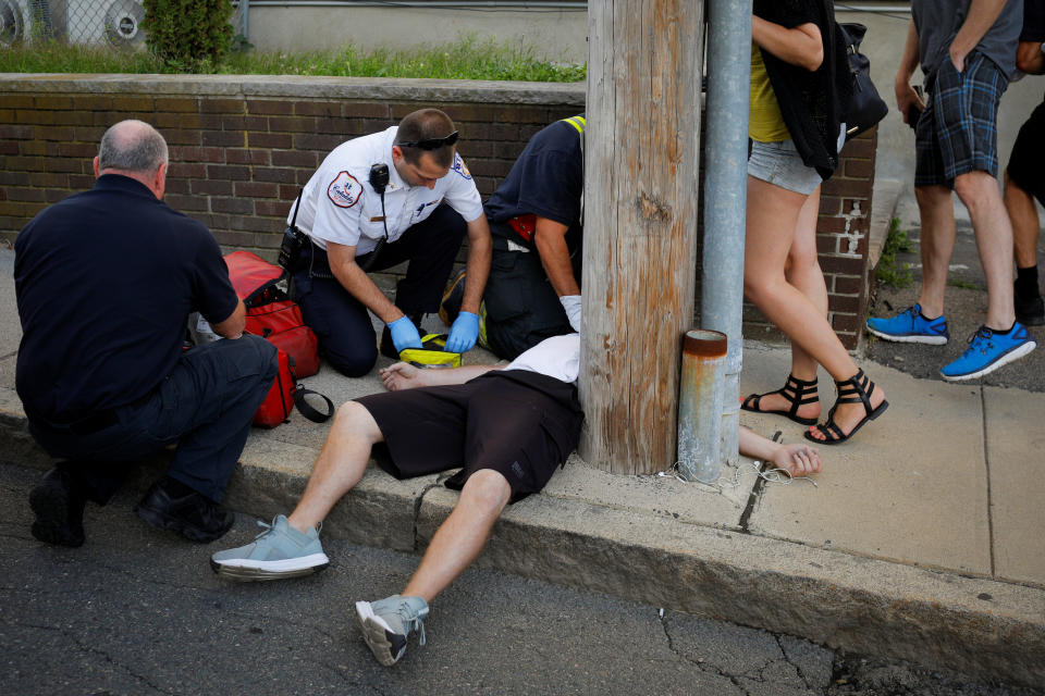 Cataldo Ambulance medics and other first responders revive a 32-year-old man who was found unresponsive and not breathing after an opioid overdose on a sidewalk in the Boston suburb of Everett, Massachusetts, U.S., August 23, 2017. REUTERS/Brian Snyder  SEARCH "SNYDER OPIOIDS" FOR THIS STORY. SEARCH "WIDER IMAGE" FOR ALL STORIES.  TPX IMAGES OF THE DAY.