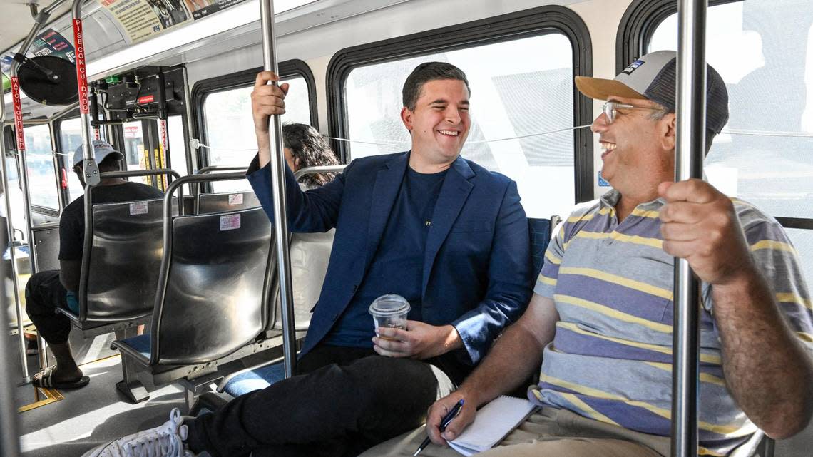 Fresno City Councilmember Tyler Maxwell, center, rides a Fresno FAX bus with Fresno Bee columnist Marek Warszawksi on Tuesday, Aug. 15, 2023.