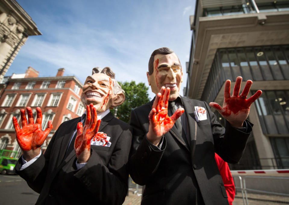 Stop the War protesters don Tony Blair and George Bush masks outside the Queen Elizabeth II Conference Centre, where the Chilcot report was released this week. The inquiry found that Tony Blair and his government of the time made many mistakes in the planning of the 2003 Iraq invasions and its immediate aftermath. London - July 6, 2016 (Rex)