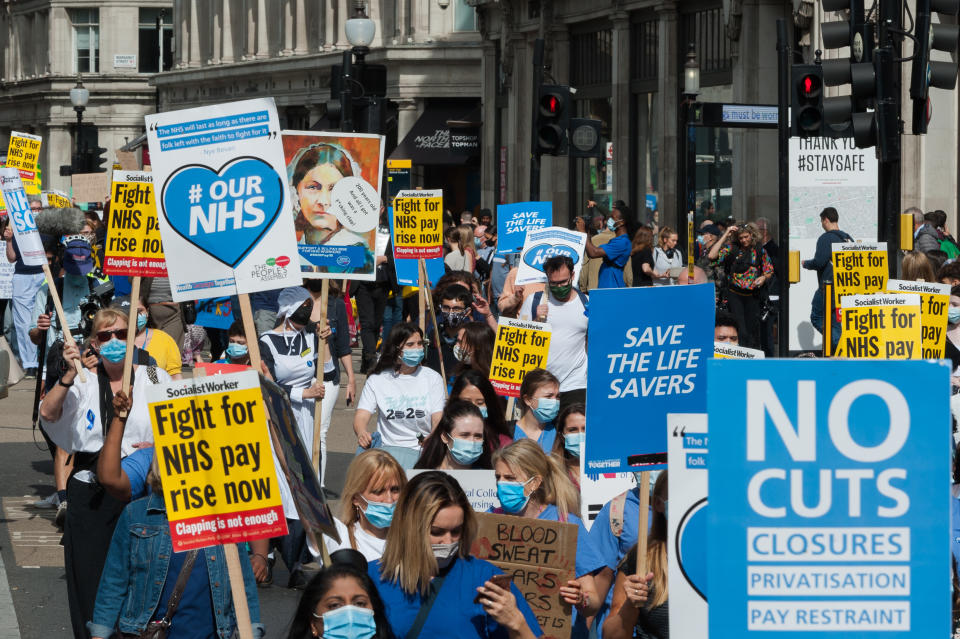 NHS staff march from BBC Broadcasting House to Trafalgar Square through central London in a protest to demand 15% pay rise for NHS workers on 12 September, 2020 in London, England. Protesters demonstrate against not being included in the government's pay deal for 900,000 public sector workers amid the sacrifices and hardship experienced during the coronavirus pandemic. (Photo by WIktor Szymanowicz/NurPhoto via Getty Images)