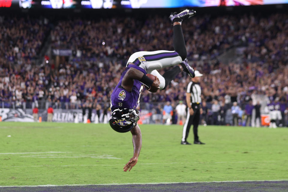 BALTIMORE, MARYLAND - SEPTEMBER 19: Lamar Jackson #8 of the Baltimore Ravens flips into the endzone for a touchdown against the Kansas City Chiefs during the fourth quarter at M&T Bank Stadium on September 19, 2021 in Baltimore, Maryland. (Photo by Rob Carr/Getty Images)