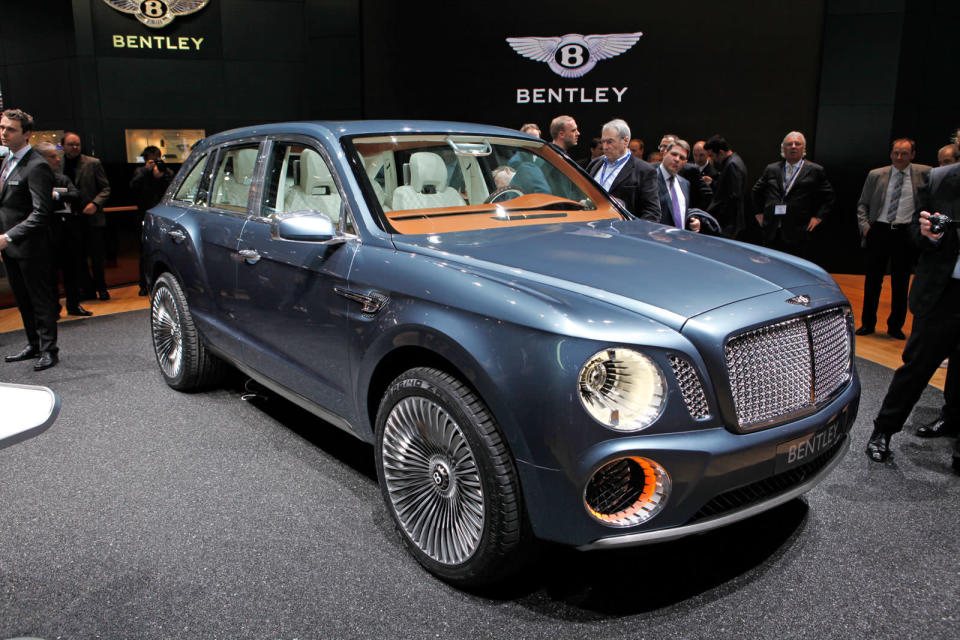 After months of rumors, Bentley revealed today a concept for its first sport utility vehicle ever: the 600-hp Bentley EXP 9 F. When it comes to vehicles for the wealthiest people in the world, restraint is so last century. With ultra-luxury vehicle sales rising on strong demand from China and the Middle East, the SUV would make the most financial sense as an addition. Given that the Continental starts around $190,000 and the Mulsanne around $280,000, it's easy to imagine a Bentley SUV with a sticker of about $250,000. Powered by a twin-turbo W-12 capable of 600 hp and 590 ft-lbs. of torque, Bentley says the EXP 9 would rank among the fastest vehicles of its kind. All that motive force gets to the ground through an 8-speed transmission and all-wheel-drive system turning 23-inch chrome wheels that are as bling-y as anything from Tire Rack. Inside lies the usual assortment of hand-stitched leathers, wood veneers and one-percentery touches like a split tailgate that folds down to reveal a custom dining set.