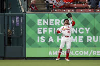 St. Louis Cardinals left fielder Brendan Donovan (33) catches a fly ball for an out against Philadelphia Phillies' Johan Rojas during the seventh inning of a baseball game Monday, April 8, 2024, in St. Louis. (AP Photo/Scott Kane)