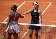 Tennis - French Open - Roland Garros, Paris, France - May 27, 2018 China's Qiang Wang shakes hands with Venus Williams of the U.S. after winning their first round match REUTERS/Christian Hartmann