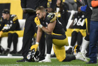 Pittsburgh Steelers tight end Pat Freiermuth (88) kneels on the sideline as Seattle Seahawks defensive end Darrell Taylor (52), unseen, is tended after being injured during the second half an NFL football game, Sunday, Oct. 17, 2021, in Pittsburgh. (AP Photo/Don Wright)