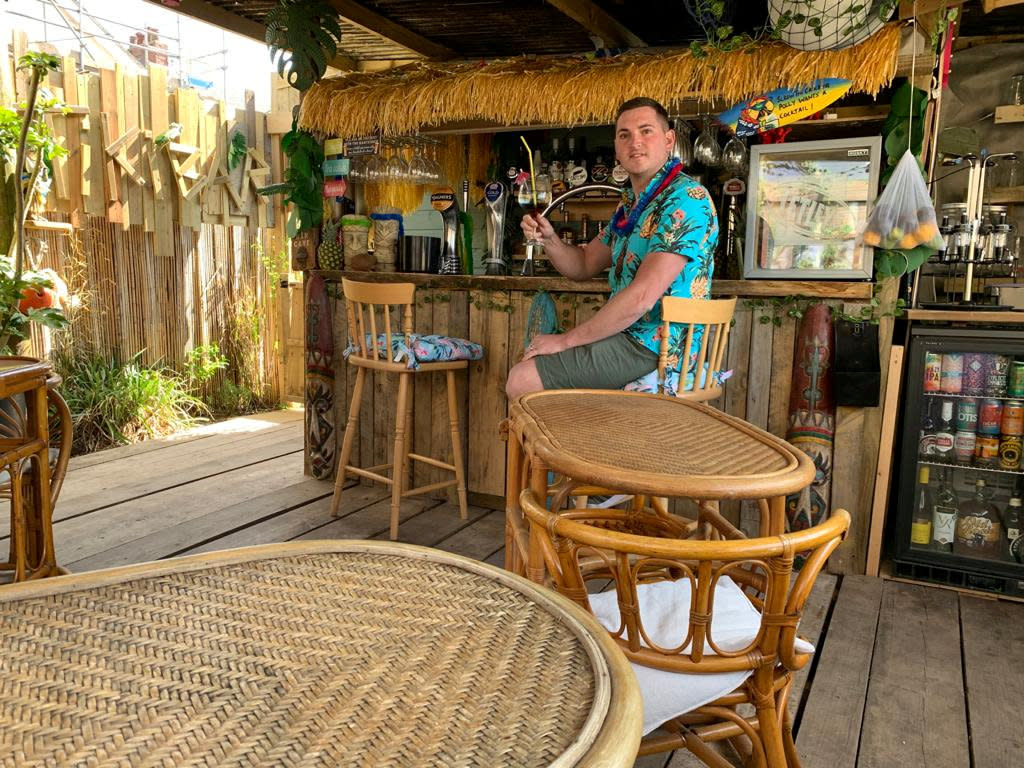 Tom Sherratt took a unique take on the lockdown garden pub and built his own tiki bar for just £800. (Tom Sherratt / SWNS.COM)