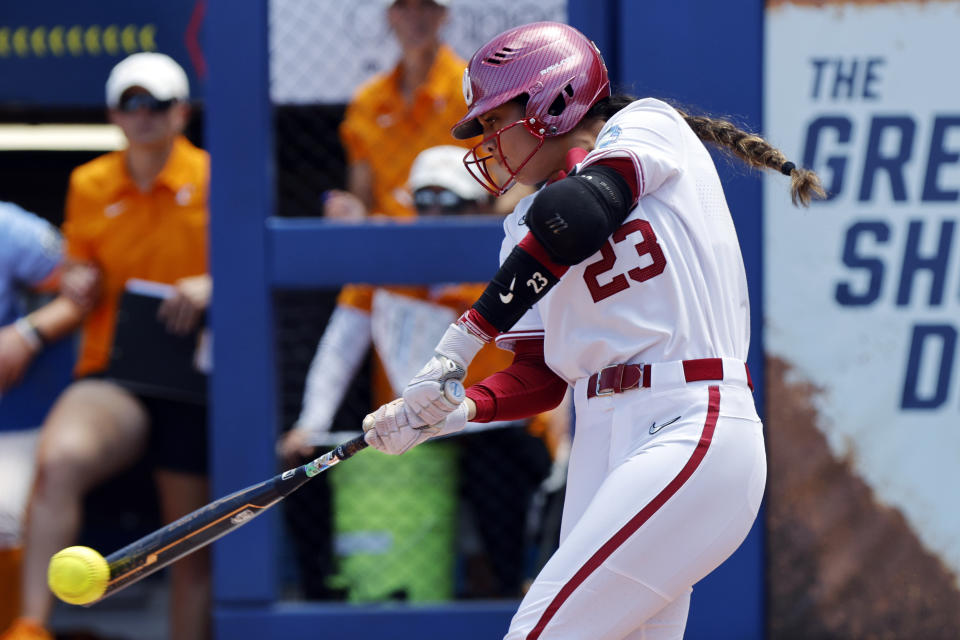 Oklahoma&#39;s Tiare Jennings hits a single against Tennessee during the Women&#39;s College World Series on June 3, 2023, in Oklahoma City. (AP Photo/Nate Billings)