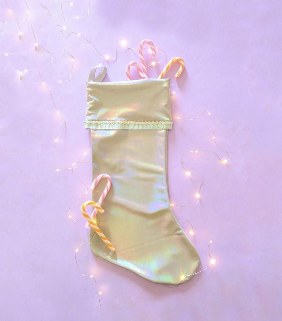 This photo shows a holographic holiday stocking sold by the shop fashionmeme on Etsy.com. From tablescapes to apparel, the gift possibilities in white are endless for the holidays. (AP Photo/fashionmem.etsy.com)