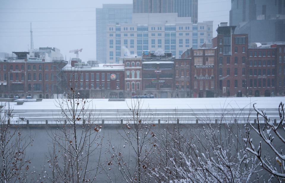 Snow begins to fall again over Downtown Nashville after an earlier winter storm hit the area Monday, Jan. 15, 2024.