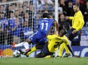 Barcelona's Gneri Toure Yaya tackles Chelsea's Didier Drogba in the penalty box