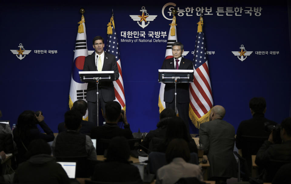 U.S. Defense Secretary Mark Esper, left, and South Korean Defense Minister Jeong Kyeong-doo, hold a joint press conference after the 51st Security Consultative Meeting (SCM) at the Defense Ministry in Seoul Friday, Nov. 15, 2019. U.S. Defense Secretary Esper says South Korea is wealthy enough to pay a bigger share of the cost of having U.S. troops on its soil. (Jung Yeon-je/Pool Photo via AP)