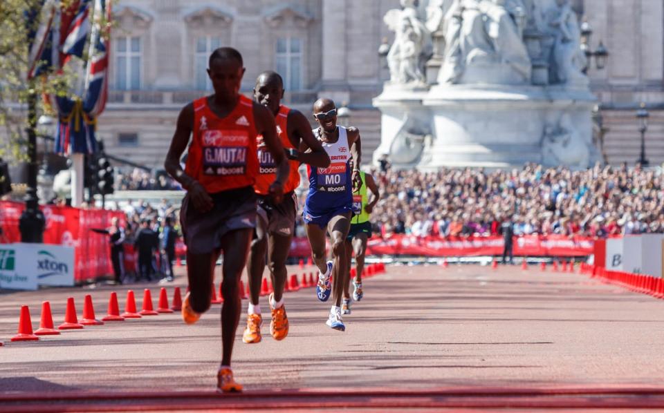 Mo Farah grimaces as he races to the finish line of the London Marathon - John Walton/PA