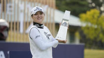 Jin Young Ko of South Korea displays the trophy after winning the final round of the BMW Ladies Championship at LPGA International Busan in Busan, South Korea, Sunday, Oct. 24, 2021. (AP Photo/Lee Jin-man)