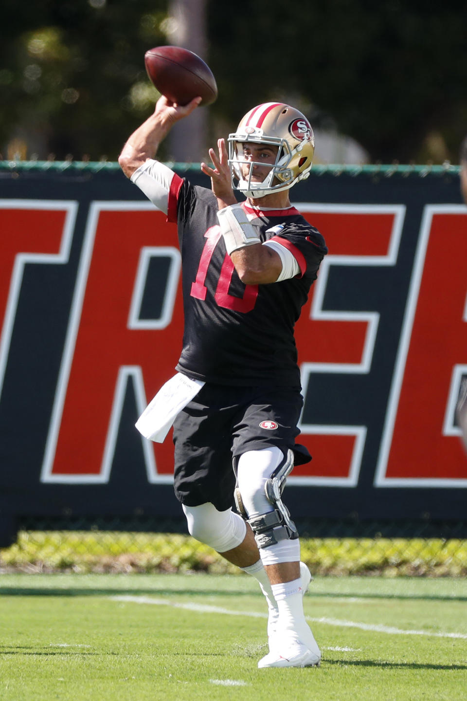 San Francisco 49ers quarterback Jimmy Garoppolo throws as he warms up during practice, Thursday, Jan. 30, 2020, in Coral Gables, Fla., for the NFL Super Bowl 54 football game. (AP Photo/Wilfredo Lee)