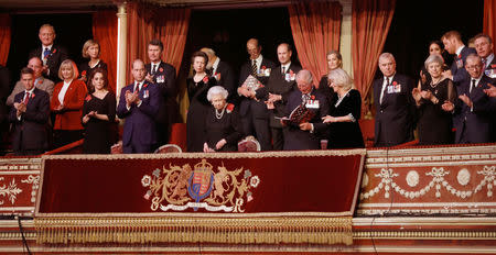 Britain's Queen Elizabeth II with members of the Royal Family and Prime Minister Theresa May attends Royal British Legion Festival of Remembrance to commemorate all those who have lost their lives in conflicts and mark 100 years since the end of the First World War, at the Royal Albert Hall, London, Britain November 10, 2018. Chris Jackson/Pool via REUTERS