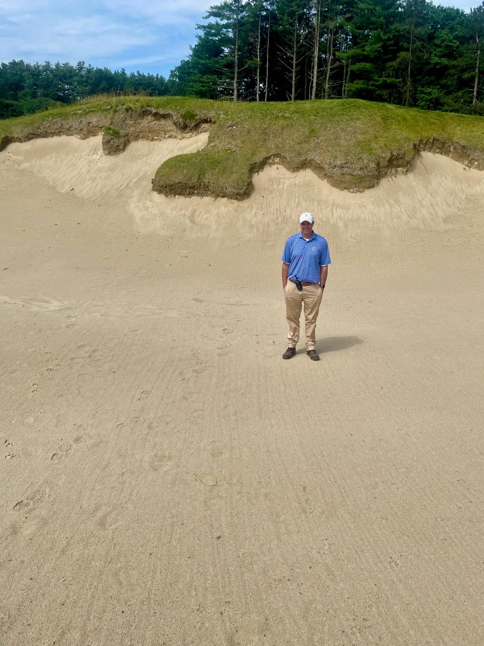 International director of agronomy Michael Gavin stands in deep bunker on the new Pines Course at the International in Bolton.