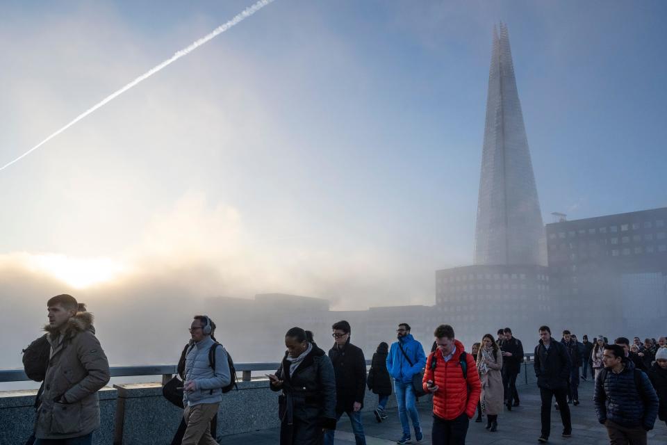 UK economy London, UK.  8 February 2023.  UK Weather – The Shard is barely seen. Fog lingers as commuters on London Bridge arrive for work in the City of London on a chilly morning.  Credit: Stephen Chung / Alamy Live News