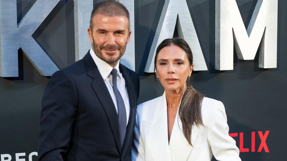 David and Victoria Beckham posing at the premiere of "Beckham."