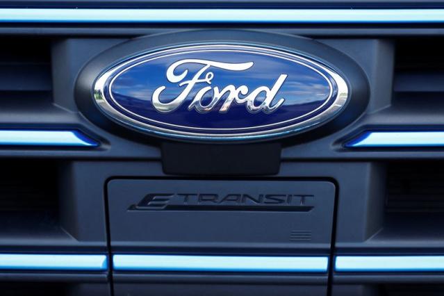 The Ford badge and E-Transit logo are seen on a vehicle at Ford’s Dunton Technical Centre in Dunton