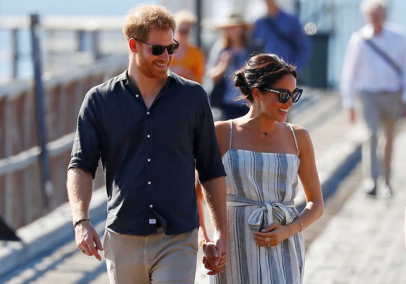 Britain's Prince Harry and Meghan, Duchess of Sussex, arrive to greet members of the public in Kingfisher Bay on Fraser Island in Queensland