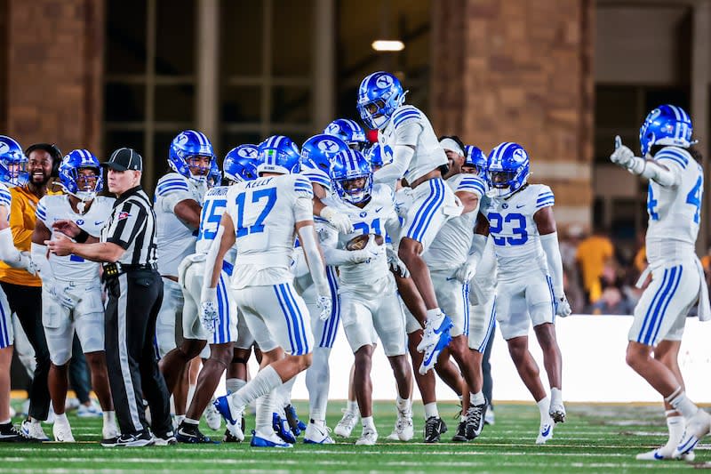 BYU football players celebrate following a play against Wyoming on Sept. 14, 2024, in Laramie. | BYU Photo