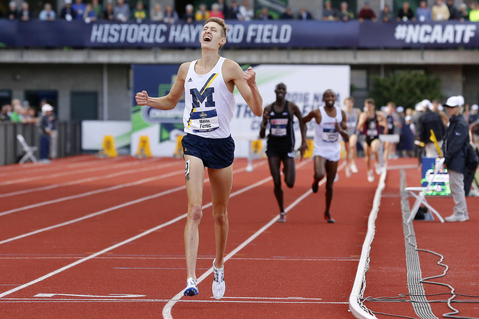 FILE - Michigan's Mason Ferlic reacts after finishing first in the men's 3000-meter steeplechase at the NCAA outdoor track and field championships in Eugene, Ore., Friday, June 10, 2016. Ferlic may someday boldly go where no steeplechaser has gone before — space. The 30-year-old with a master's in aerospace engineering from Michigan has aspirations to become an astronaut. For now, that plan remains a galaxy away. Ferlic's focus is on the track this week at the U.S. Olympic Trials as he tries to earn a spot at for Paris Games.(AP Photo/Ryan Kang, File)