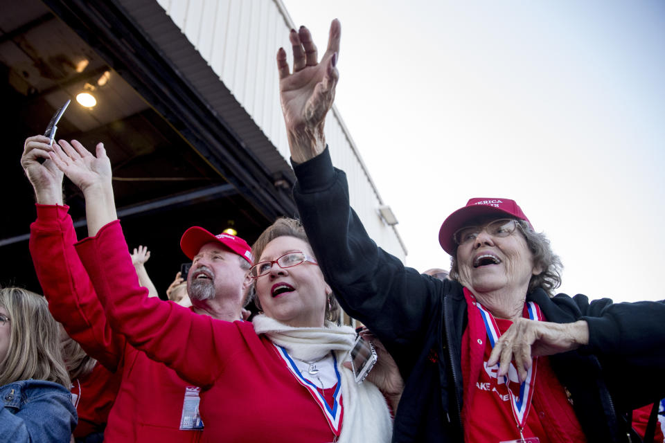 Members of the audience cheer as President Donald Trump arrives for a rally at Southern Illinois Airport in Murphysboro, Ill., Saturday, Oct. 27, 2018. (AP Photo/Andrew Harnik)