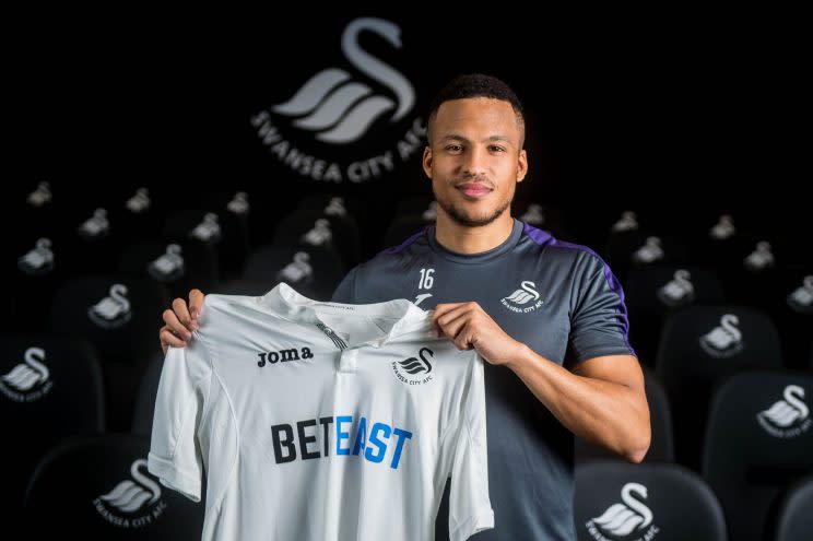 Martin Olsson signs for the Swans
