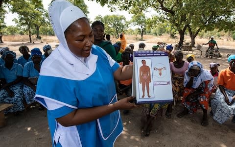 A Marie Stopes nurse in Ghana delivers a community family planning lecture - Credit: Simon Townsley