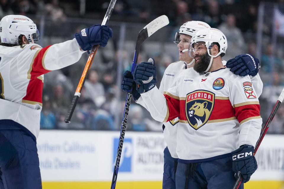 Florida Panthers defenseman Radko Gudas, right, celebrates with teammates after scoring against the San Jose Sharks during the second period of an NHL hockey game in San Jose, Calif., Thursday, Nov. 3, 2022. (AP Photo/Godofredo A. Vásquez)