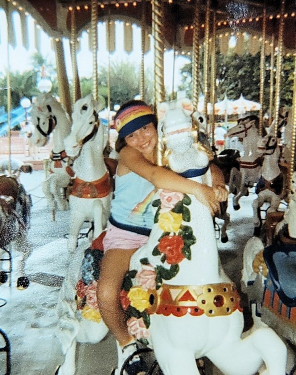 Melanie Green Merrill has been riding the same carousel horse for years at Magic Kingdom, which she affectionately named Cindy.