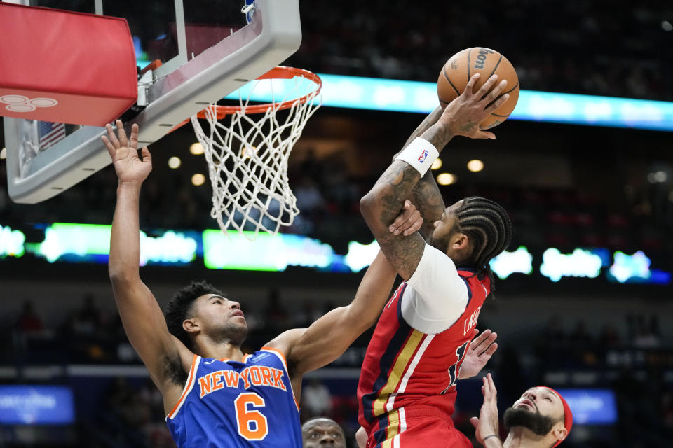 New Orleans Pelicans forward Brandon Ingram goes to the basket against New York Knicks guard Quentin Grimes (6) in the first half of an NBA basketball game in New Orleans, Saturday, Oct. 28, 2023. (AP Photo/Gerald Herbert)